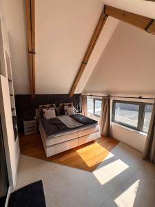 a bedroom with a bed in the middle of a room at Casa Fux in Grassnitzberg