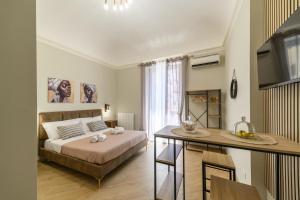 Ένα ή περισσότερα κρεβάτια σε δωμάτιο στο Oros rooms