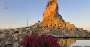 a view of a mountain with a bunch of flowers at Portal Cappadocia - Adults Only Cave Hotel in Ortahisar