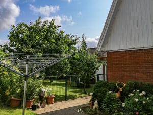 a garden in front of a house at Ferienhaus Malmö in Tessin +26 photos