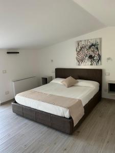 Postel nebo postele na pokoji v ubytování Biancolivo Country House