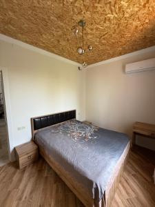 Postel nebo postele na pokoji v ubytování Guesthouse Mtsvane Koncxi 22