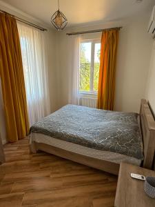 Postel nebo postele na pokoji v ubytování Guesthouse Mtsvane Koncxi 22