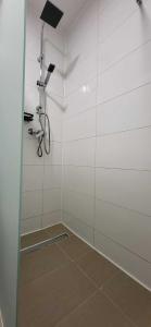 a bathroom with a shower with a bike on the wall at Pension Wolf in Gersdorf