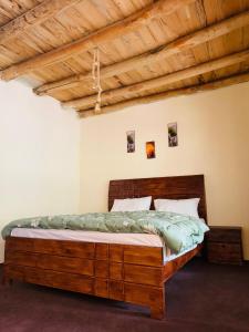 A bed or beds in a room at The Indus Escape
