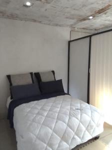 Postel nebo postele na pokoji v ubytování Mokoena Village guesthouse