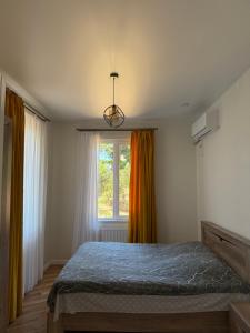 Postel nebo postele na pokoji v ubytování Guesthouse Mtsvane Koncxi 22