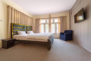 A bed or beds in a room at The Indus Escape