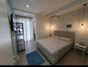 a bedroom with a bed and a ladder in it at Playa-degli-Angeli-LEVANTE in Gabicce Mare