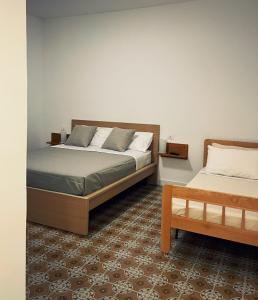 เตียงในห้องที่ La Ginestra