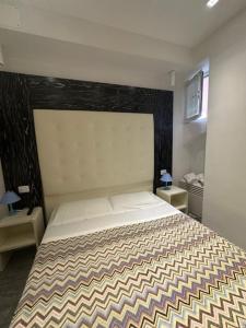a bedroom with a large bed and two night stands at Affittacamere Ca' Dei Lisci in Riomaggiore +28 photos