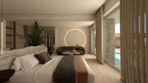 a bedroom with a large bed and a couch at Uzenie All Suites Boutique Resort in Adelianos Kampos