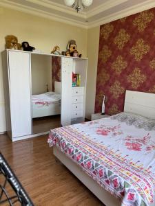 Postel nebo postele na pokoji v ubytování Guesthouse Mtsvane Koncxi 22