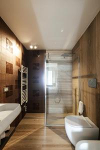 a bathroom with a toilet and a sink and a shower at MAREKI60 - Il Paradisino Beach Club in San Vincenzo +66 photos