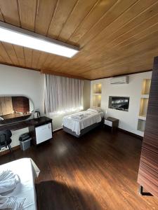 A bed or beds in a room at Gold Corner Hotel