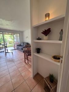 a living room with a couch and a table at Appartement de vacance in Uhart-Cize