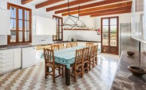 a kitchen with a table and chairs in a room at Villa Son Granada Llucmajor in Llucmajor