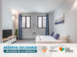 Televízia a/alebo spoločenská miestnosť v ubytovaní Apartamentos Realejo Granada Centro 3000