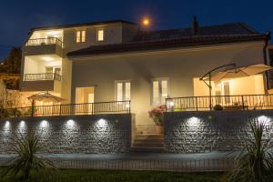 a house at night with lights at Dida moj in Senj