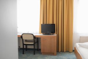 Televisyen dan/atau pusat hiburan di Dom-Hotel