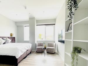 Ένα ή περισσότερα κρεβάτια σε δωμάτιο στο Private Room With Cozy Bed, Bathroom & Wifi