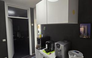 a kitchen with a counter with a coffee maker on it at Let's RelaxX 1703 in Mülheim an der Ruhr