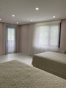 a bedroom with two beds and a window at Trabzon rize in Of +18 photos