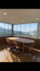 a table and chairs in a room with a large window at Trabzon rize in Of +18 photos