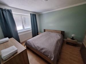 Ένα ή περισσότερα κρεβάτια σε δωμάτιο στο Apartmán Banská Bystrica