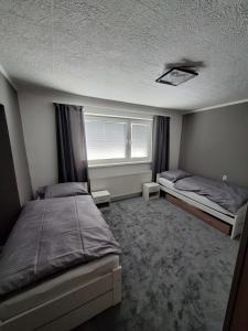 Ένα ή περισσότερα κρεβάτια σε δωμάτιο στο Apartmán Banská Bystrica