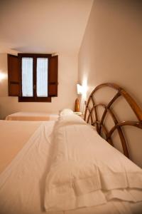 Postel nebo postele na pokoji v ubytování Hotel Moderno