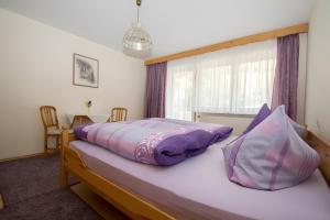 Postel nebo postele na pokoji v ubytování Ferienwohnung Vergissmeinnicht