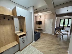 a living room with a couch and a table at Tower Apartments in Osh