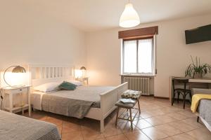 Postel nebo postele na pokoji v ubytování InGarda Rooms