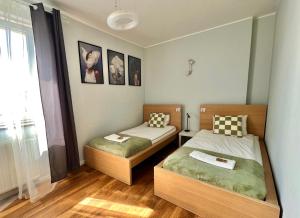 Postel nebo postele na pokoji v ubytování Warsaw Concierge Koszykowa