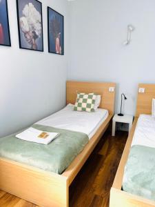 Postel nebo postele na pokoji v ubytování Warsaw Concierge Koszykowa