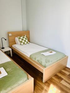 Postel nebo postele na pokoji v ubytování Warsaw Concierge Koszykowa