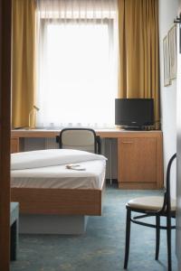 Katil atau katil-katil dalam bilik di Dom-Hotel