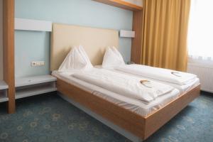 Katil atau katil-katil dalam bilik di Dom-Hotel