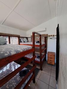 Postel nebo postele na pokoji v ubytování Mazi Vuwu Ponta Malongane 4x4 only