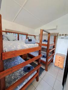 Postel nebo postele na pokoji v ubytování Mazi Vuwu Ponta Malongane 4x4 only