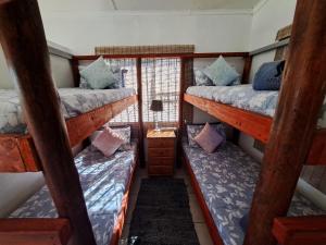 Postel nebo postele na pokoji v ubytování Mazi Vuwu Ponta Malongane 4x4 only