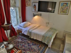 Cama ou camas em um quarto em Dar Souad