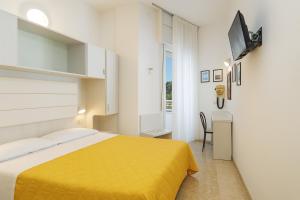 A bed or beds in a room at Hotel Imperiale