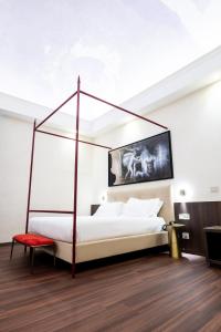 Postel nebo postele na pokoji v ubytování Hotel Vittoria