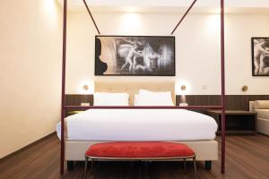 Postel nebo postele na pokoji v ubytování Hotel Vittoria