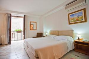 Postel nebo postele na pokoji v ubytování Hotel Moderno