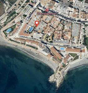 a map of a city with a red circle at SHR043 Nerja Medina Apartamento cerca de Playa Torrecilla in Nerja