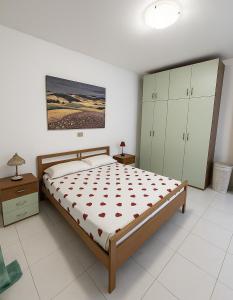 Postel nebo postele na pokoji v ubytování DreamLiving Vasto Ponente