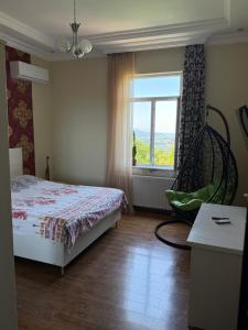 Postel nebo postele na pokoji v ubytování Guesthouse Mtsvane Koncxi 22